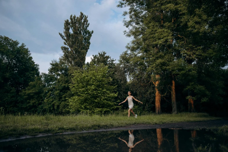 a man in the middle of some water throwing a frisbee