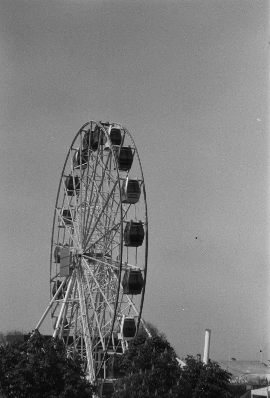 a ferris wheel with a sky background in the back ground