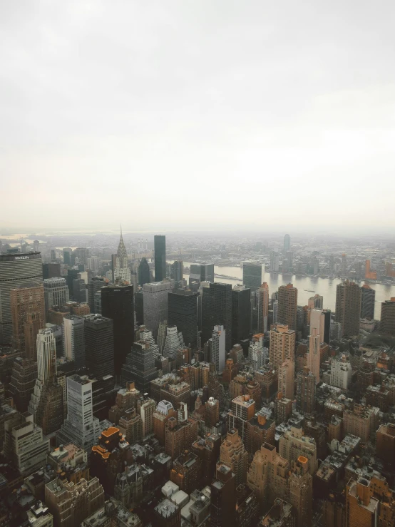 a cloudy day in a city with lots of tall buildings