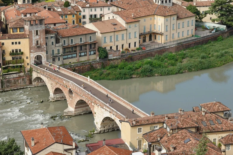 a bridge spans over the water in an old city