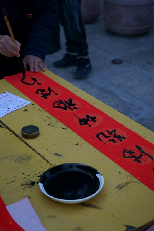 the table is made of wood and has writing on it