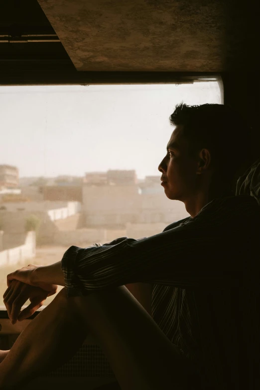 a person in a bus looking out the window