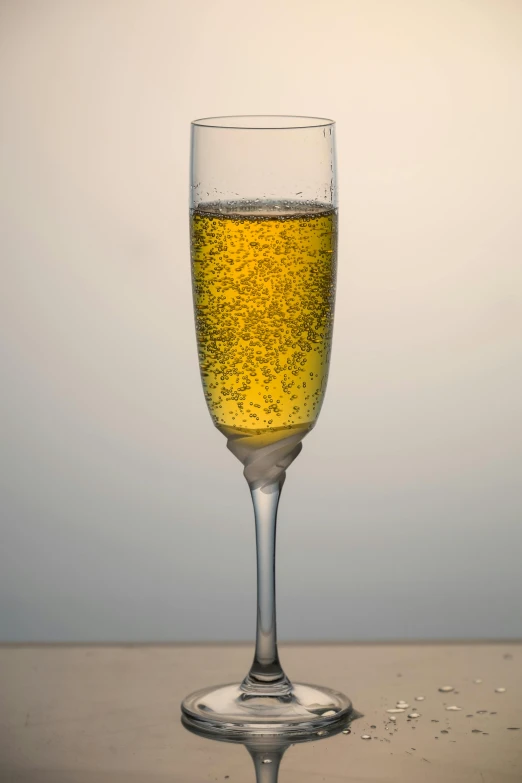 a glass of beer sitting on top of a counter