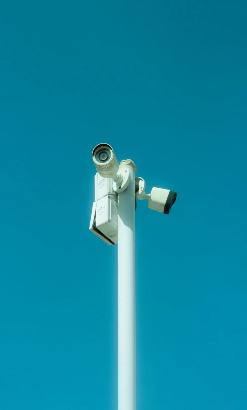 the camera on the pole is pointed up to see the sky