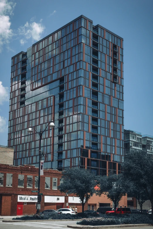 a tall glass building sitting next to a street