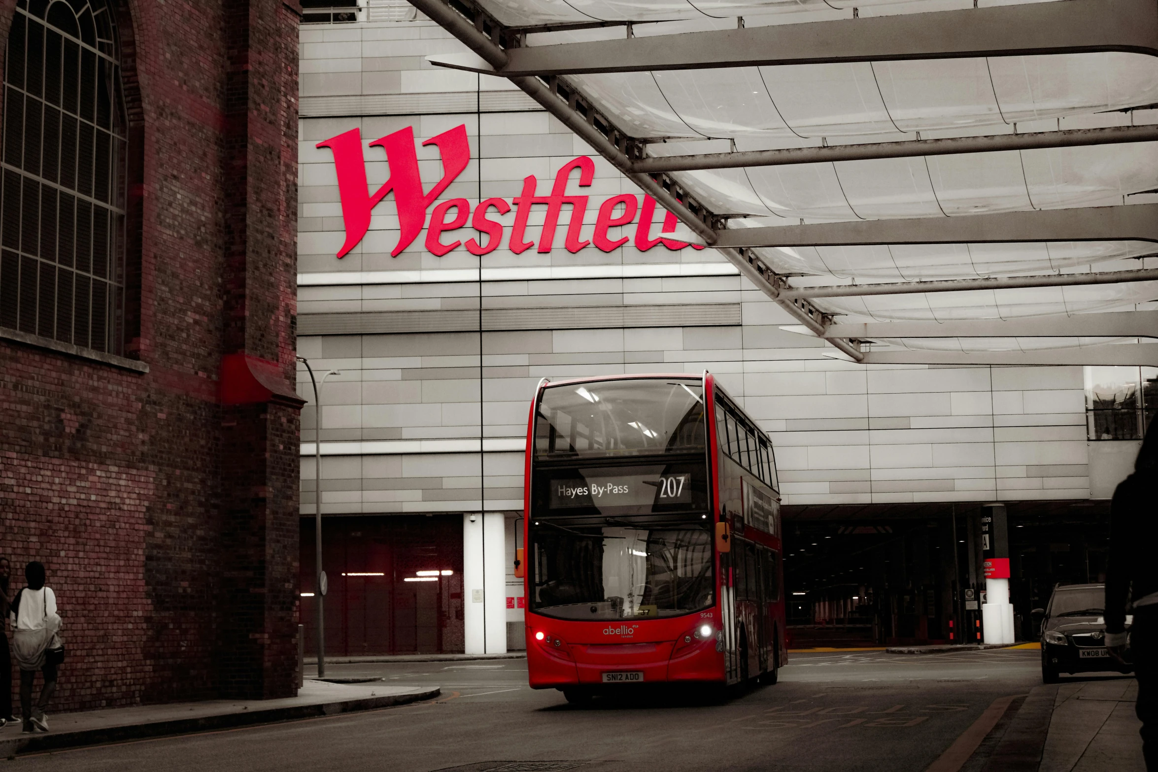 a double decker bus driving down the street