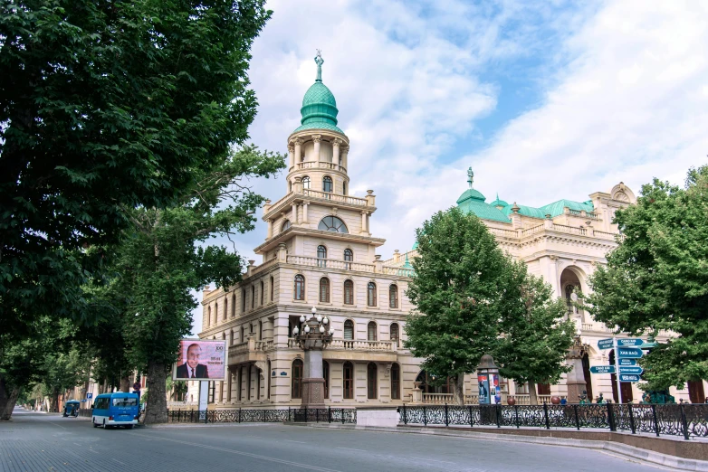 a truck is driving in front of an old building