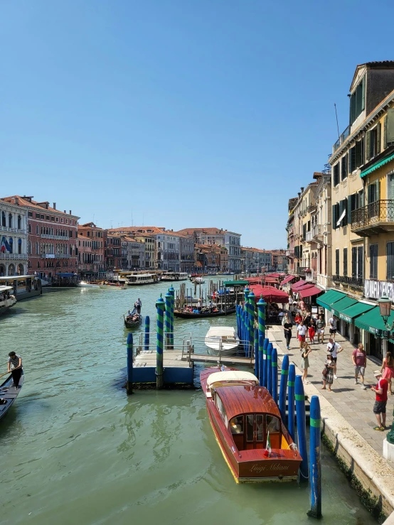 a body of water with people walking down it