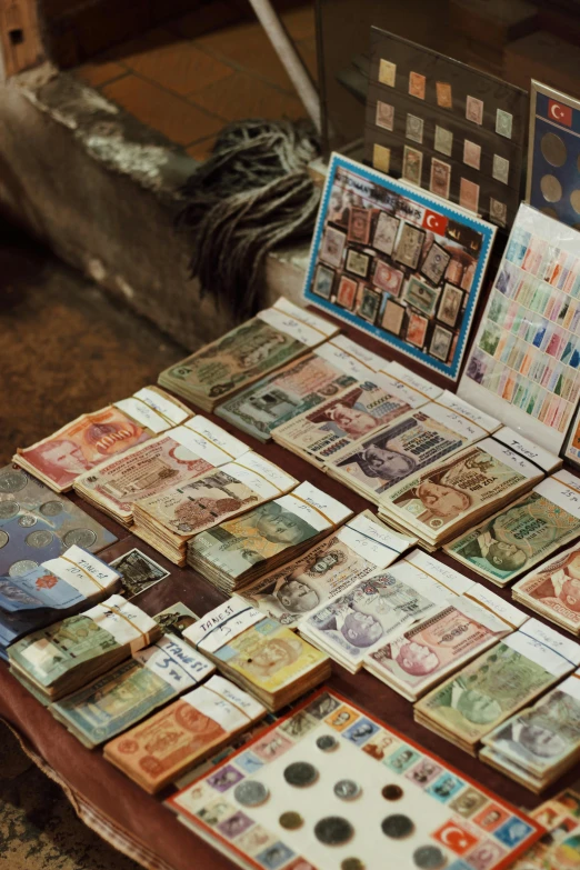 the table is covered in different kinds of currency