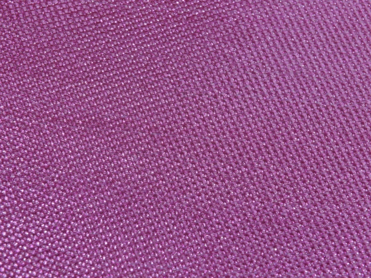 a purple fabric with white dots on it