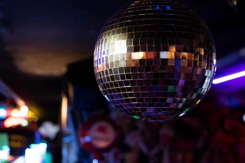 a disco ball hanging from the ceiling at night