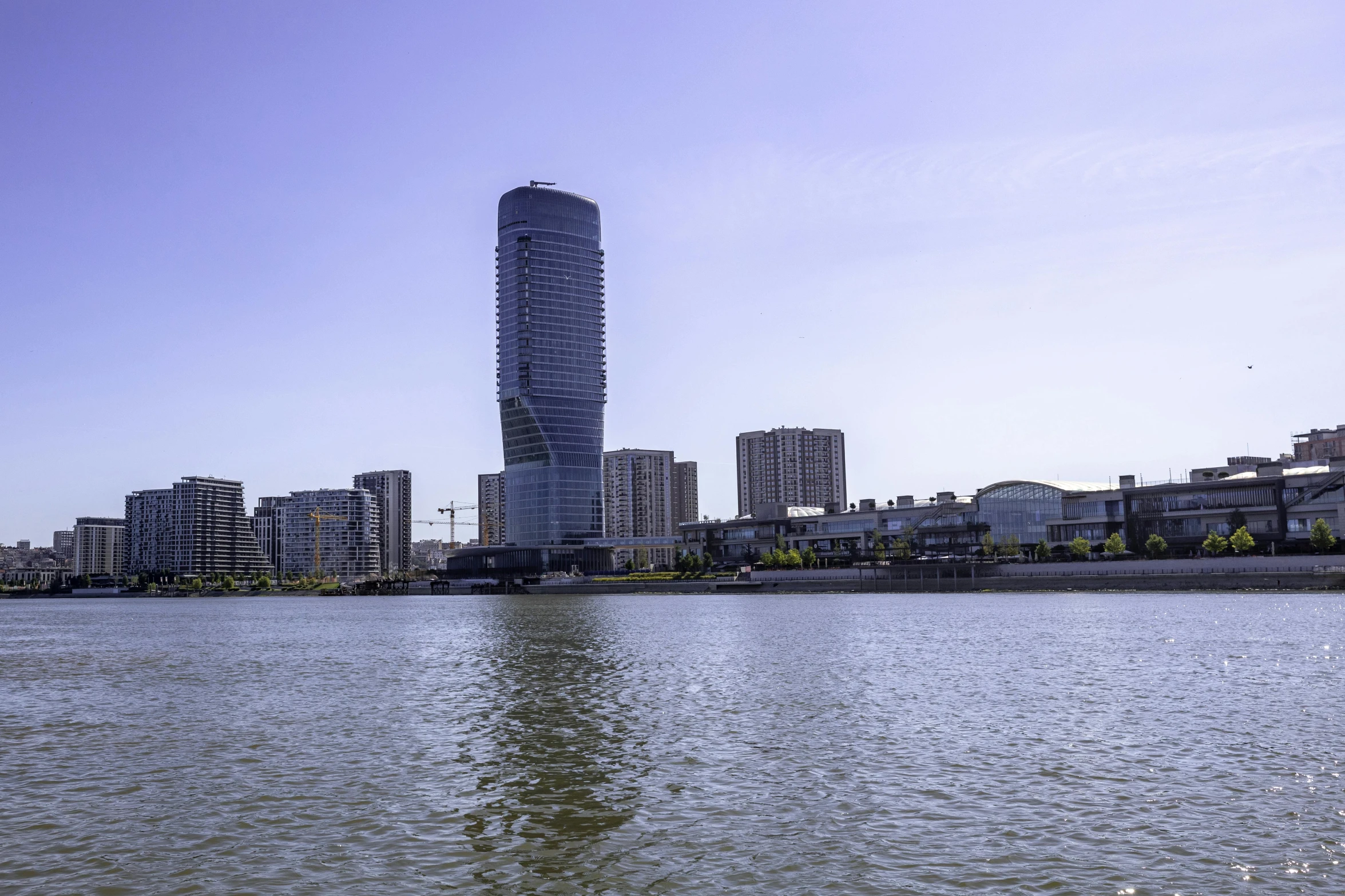 a large body of water that is surrounded by tall buildings