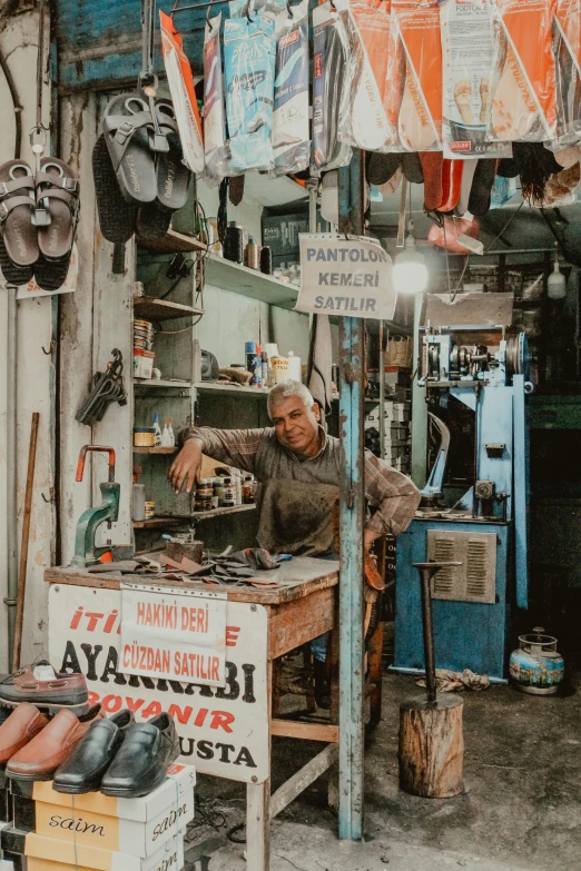 an old man standing in a shoe store