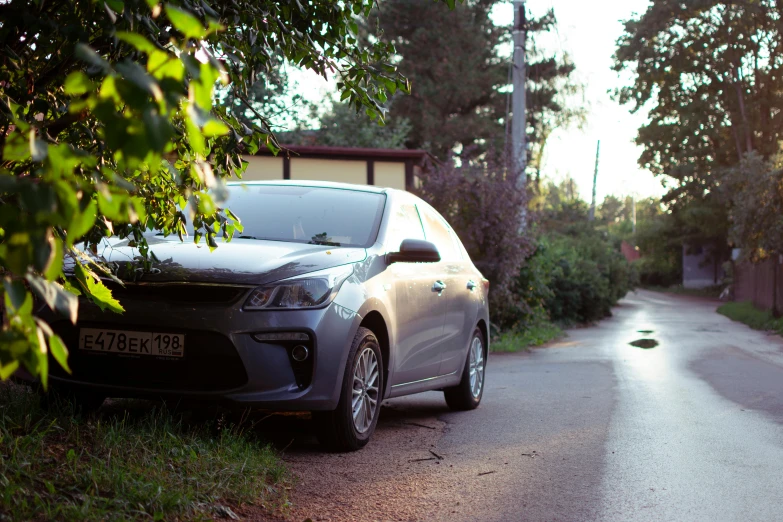 a black car sits on the side of a road