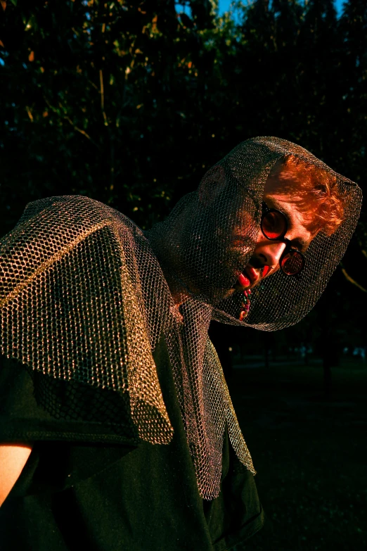 a man wearing a neck piece in an open park