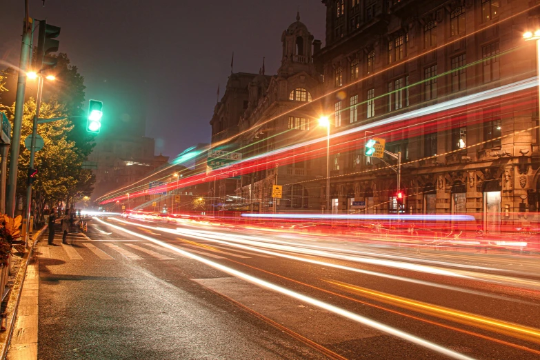 blurry lights on a street at night, with an empty sidewalk