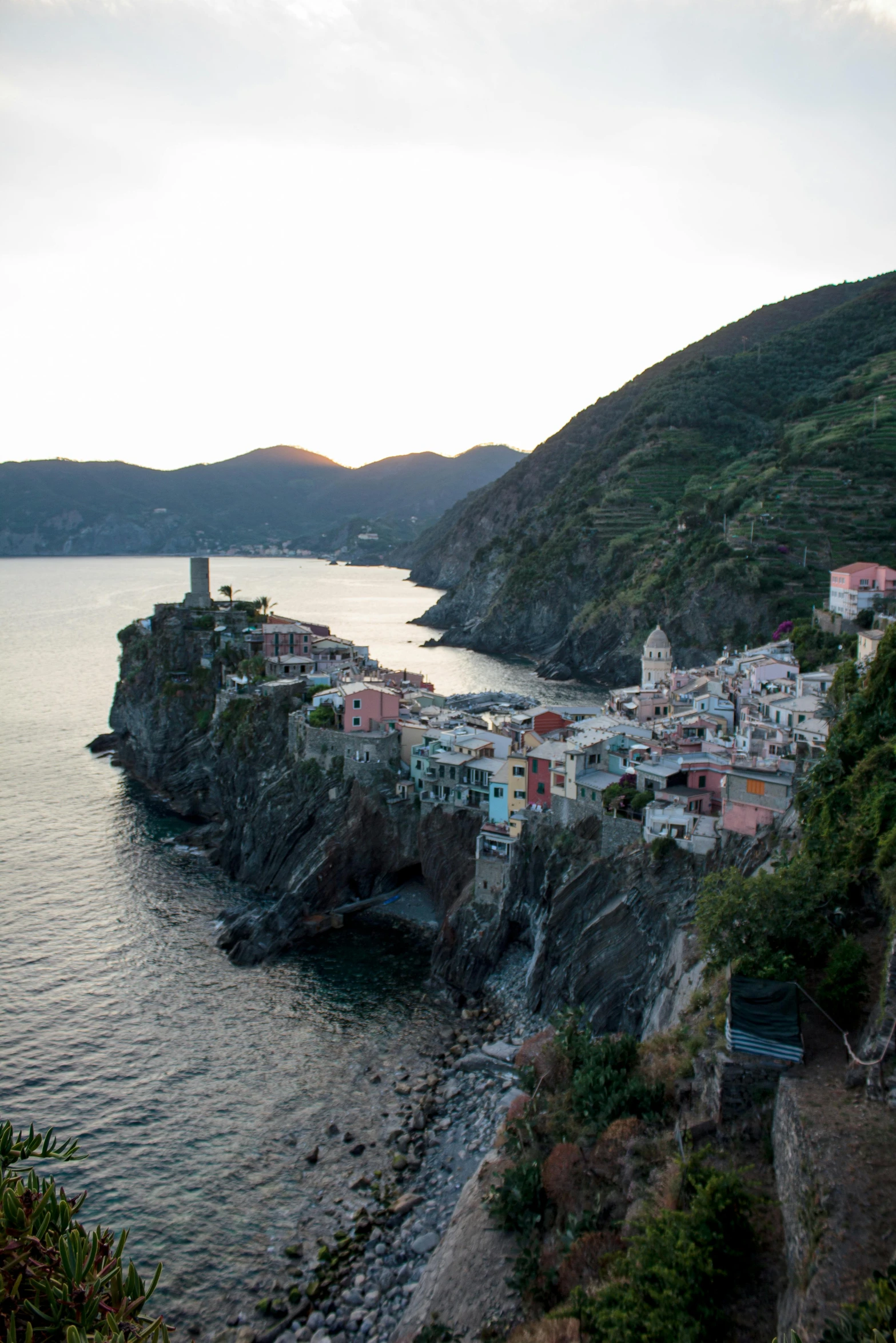 an image of some buildings by the water