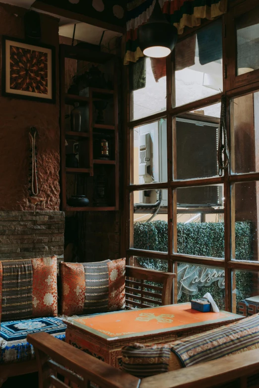 the interior of a restaurant with lots of windows