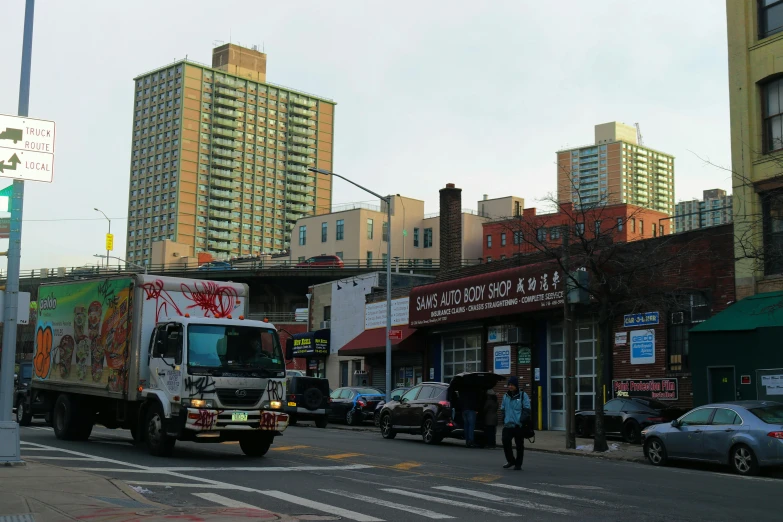 the delivery truck is passing through an intersection