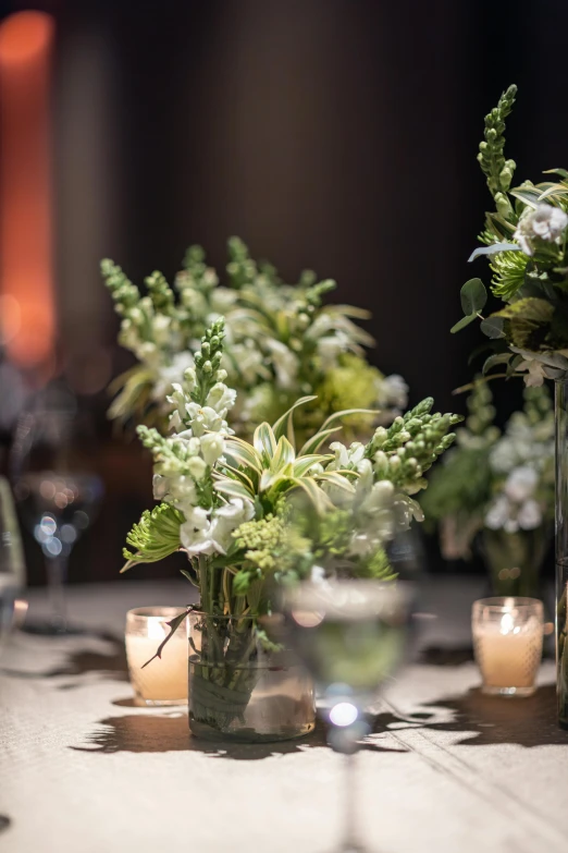 a table with some flower and candles at it