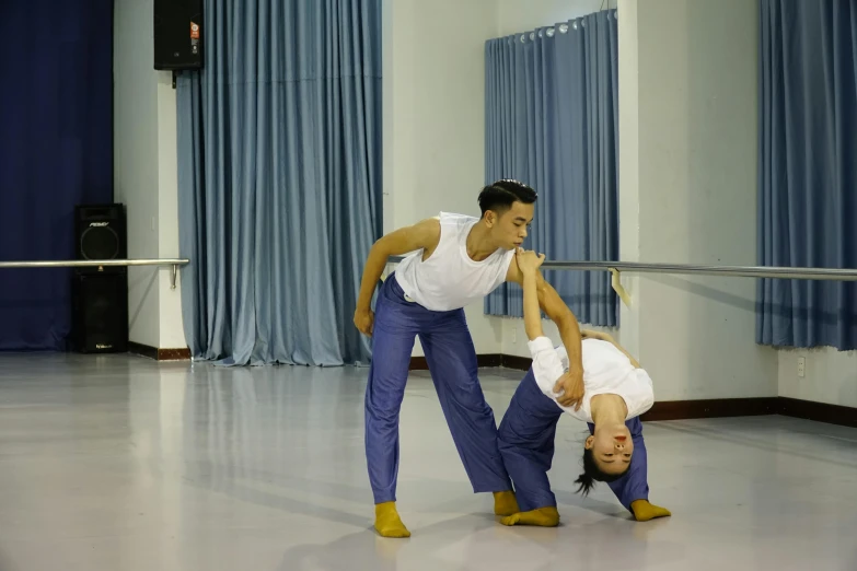 man and woman in dance routine during a show