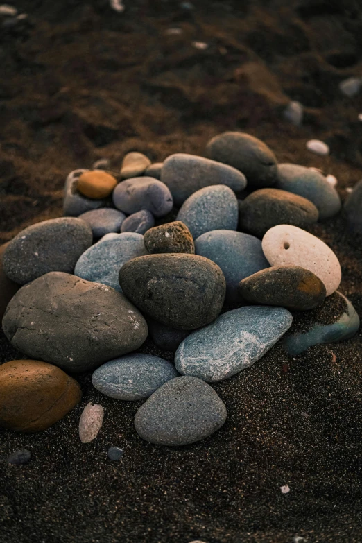 many rocks are placed together on the ground