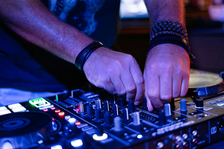 a man mixing music with his hands