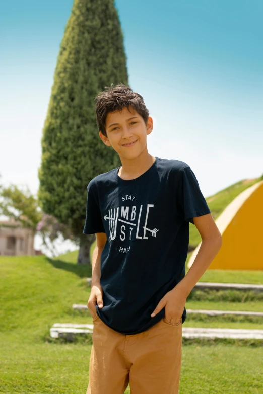 a boy with one foot on a skateboard