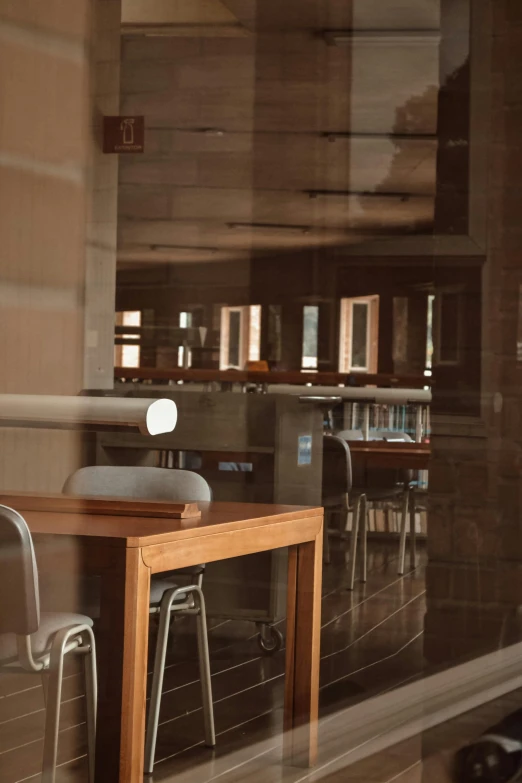 a room with some chairs around tables