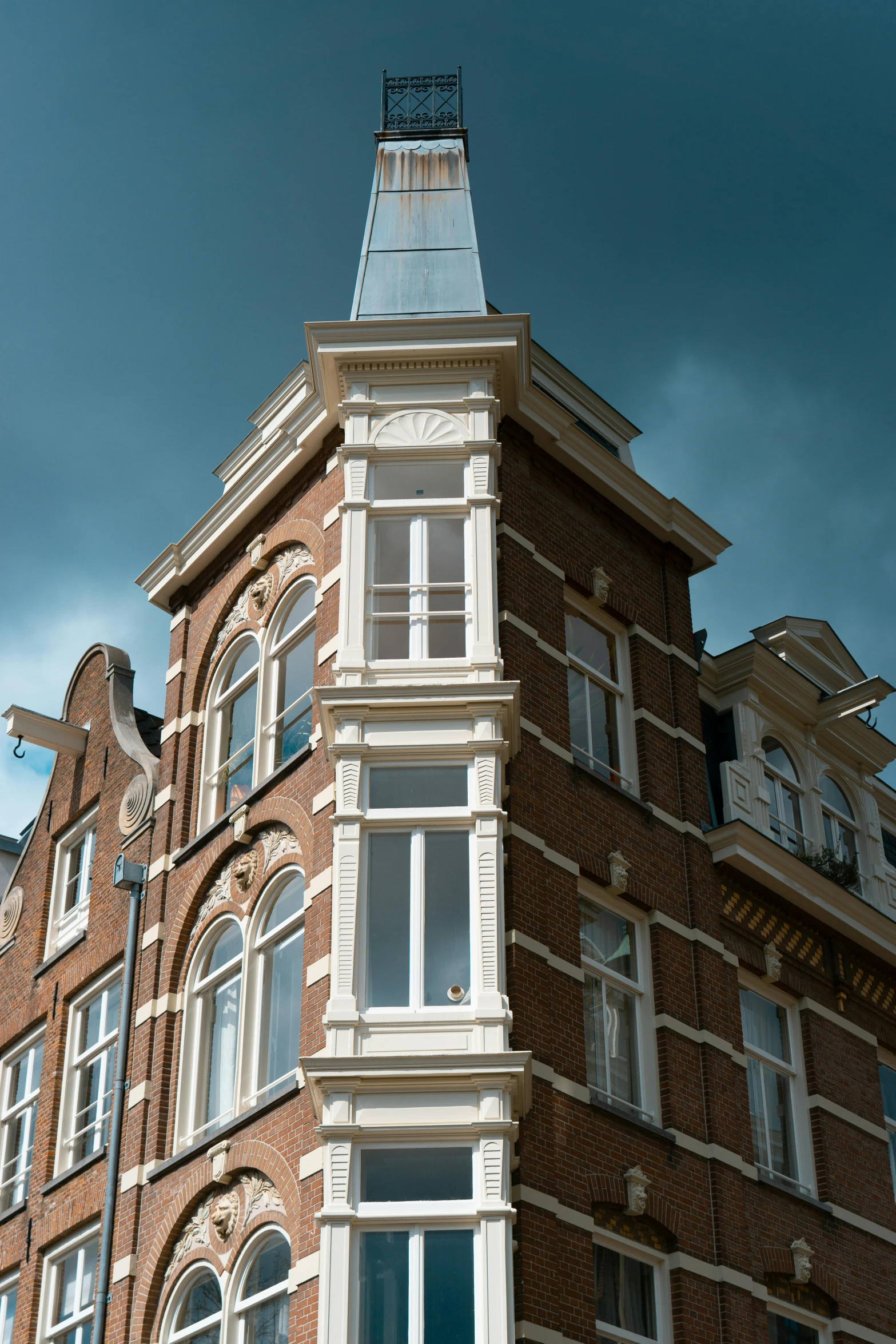 a red brick building with a clock on the top