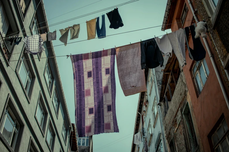 several clothes hanging up outside on a clothes line