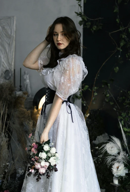 a  with dark hair dressed in a wedding dress