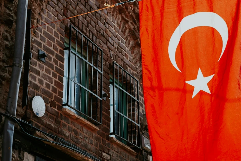 a flag hanging outside of a building