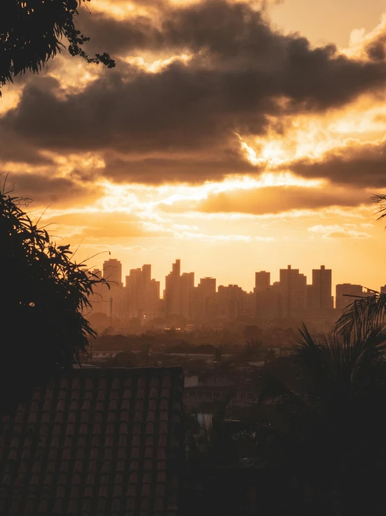 an image of the sun setting over a city