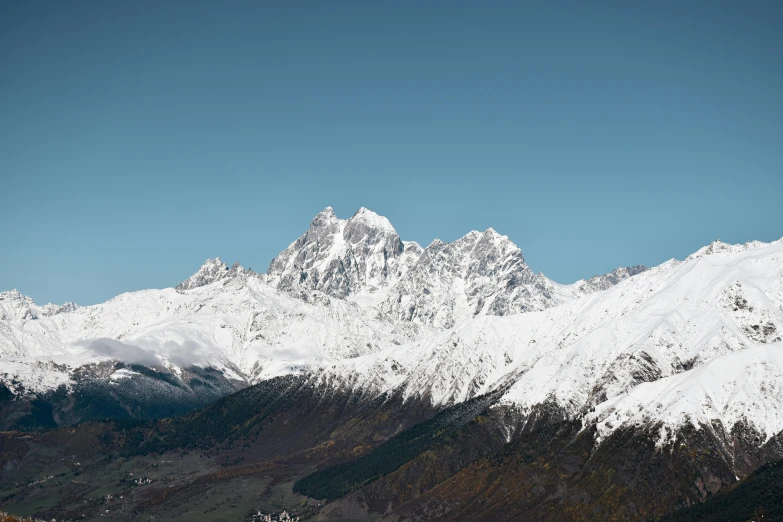 snowy mountains are seen in the background on a clear day