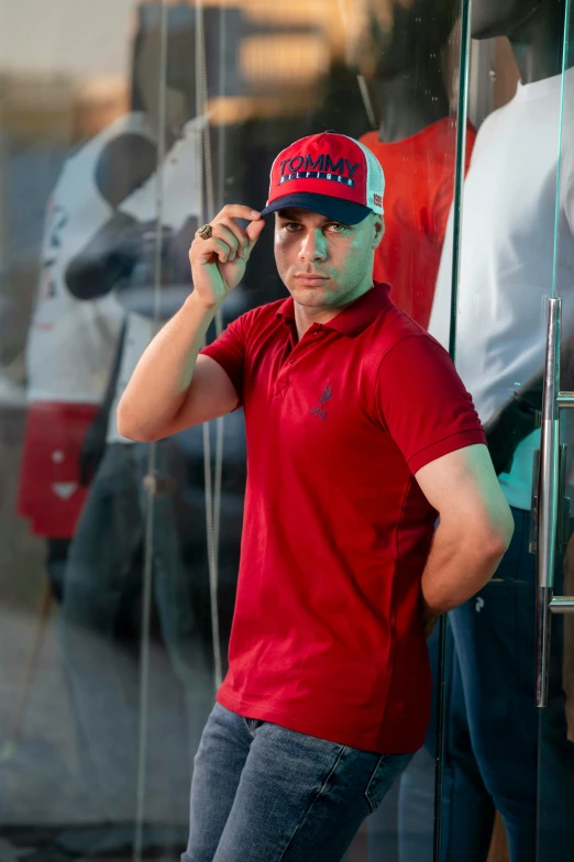 a man standing in front of a large glass window