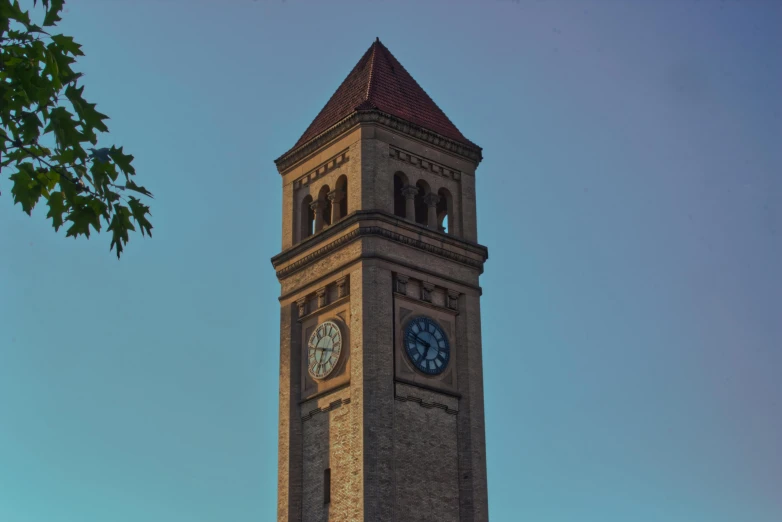 a large clock tower with many clocks on each face