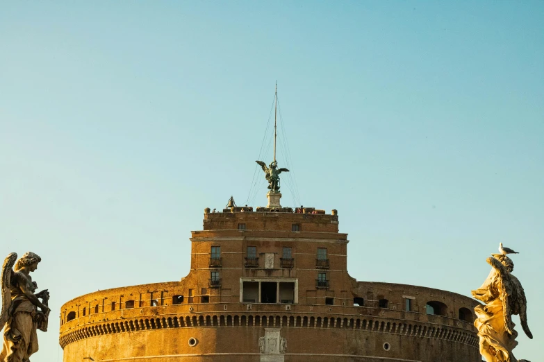 the top part of an old building with sculptures on it