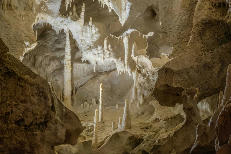 a room in the cave with icicles hanging from the ceiling