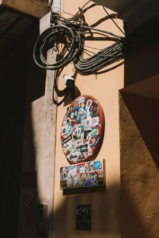 a clock with many different pictures hanging up on it