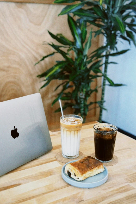 two drinks and toast sit on a table