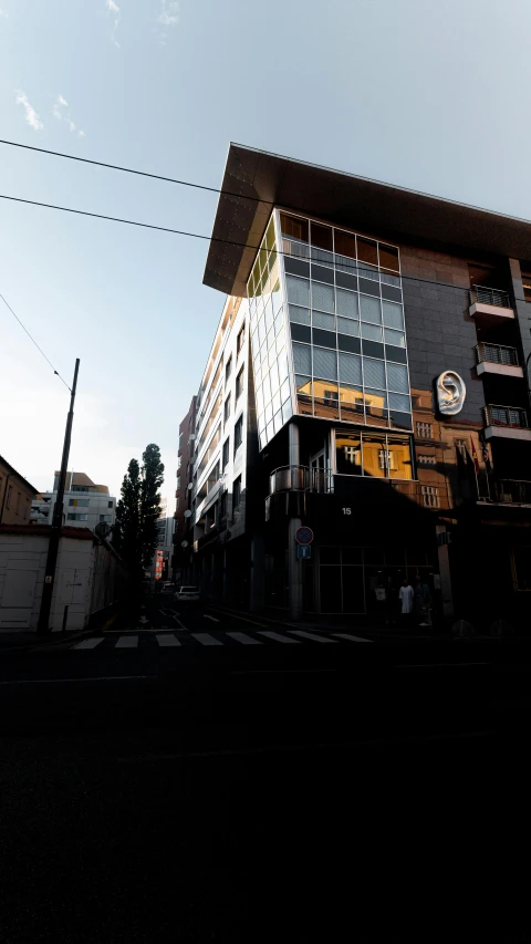 a long building sits in the middle of the street