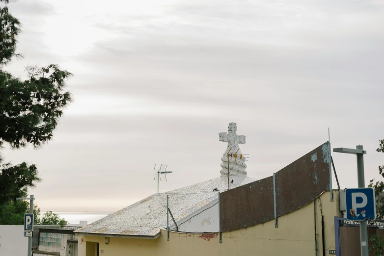 a view of an old building and sign with a lot of snow on it