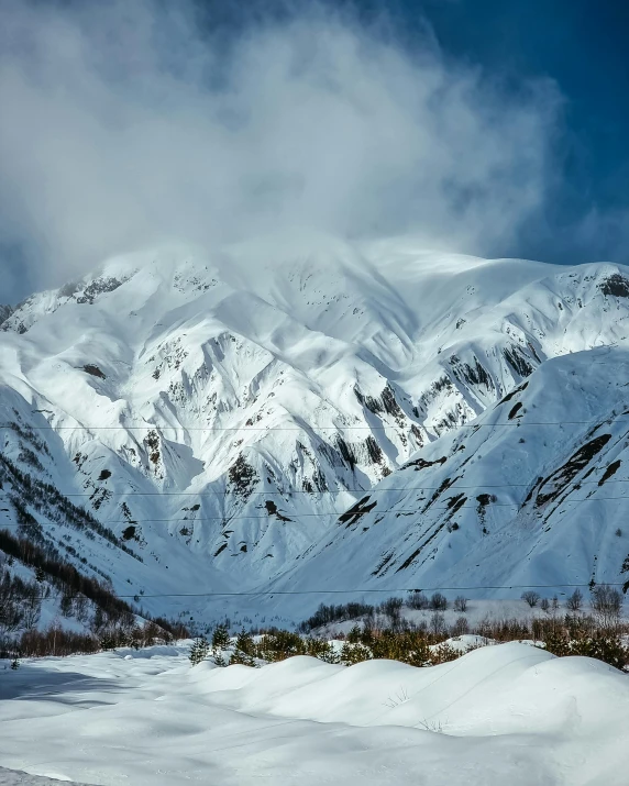 an image of mountains with snow on the tops