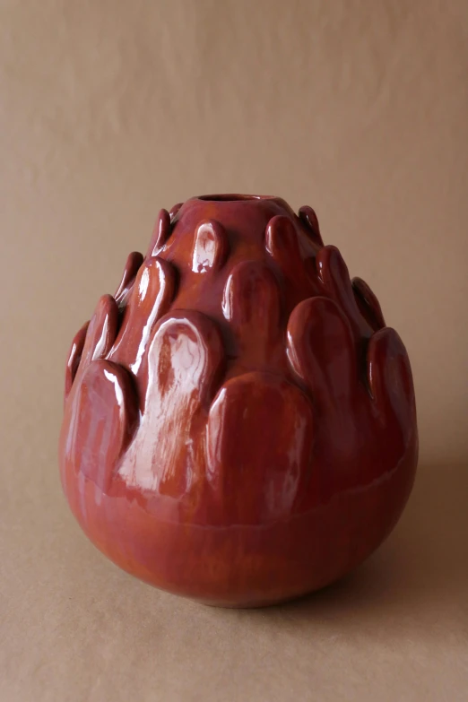 a decorative vase is on display on the table