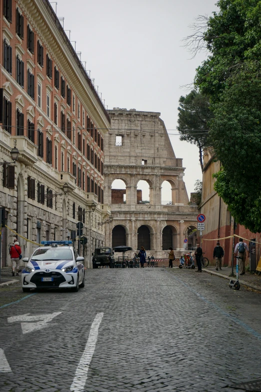 a police car is parked in an open street