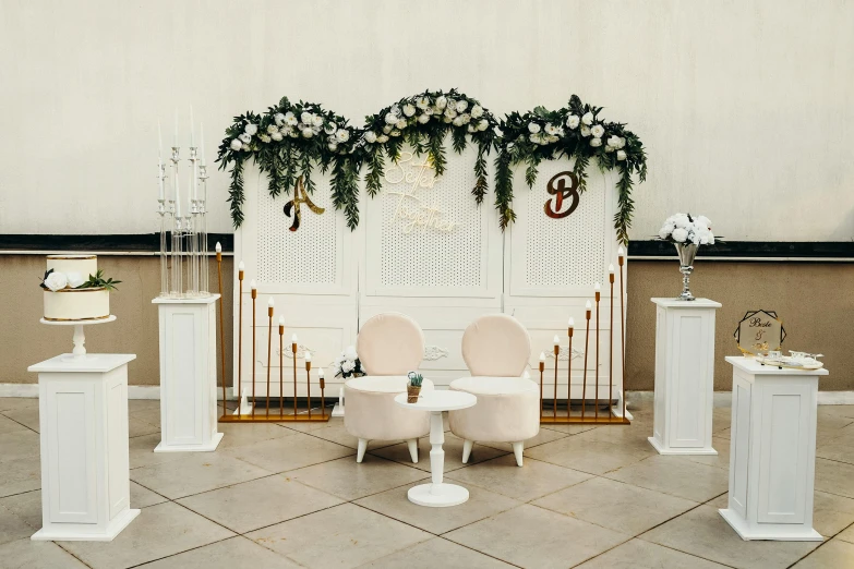 a table that has two white chairs at it