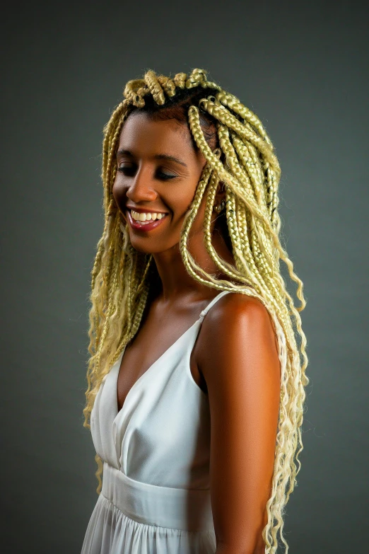 a pretty blonde with long hair smiling at the camera