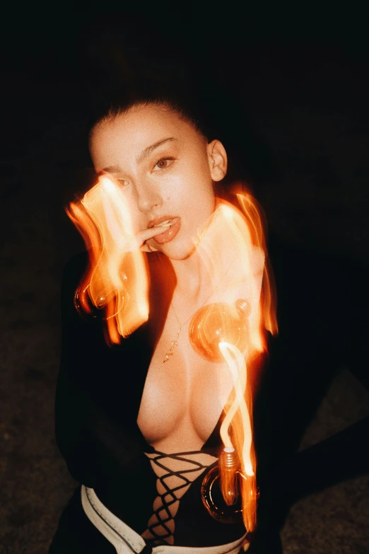 a woman with flames around her back and arms