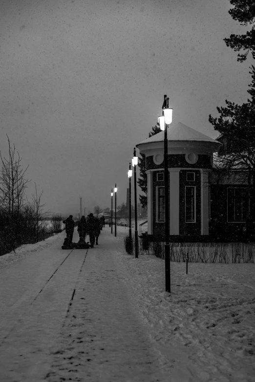 a road with lots of snow and a stop light